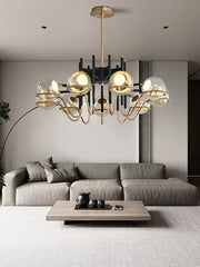 Modern gold and gray glass ceiling chandelier with metal arms and spherical decorbites gray glass globes for living room decor
