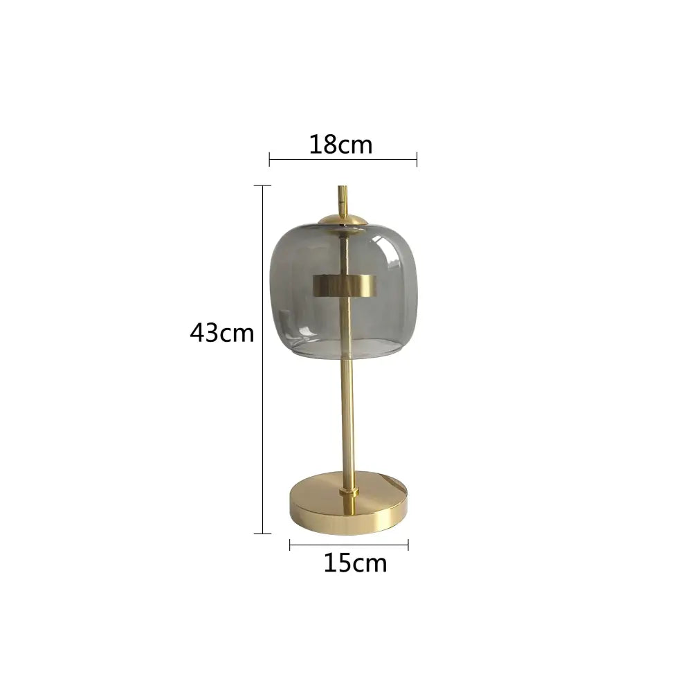 Modern gold and gray glass table lamp with brass finish and minimalist design for bedroom decorbites glass table lamp