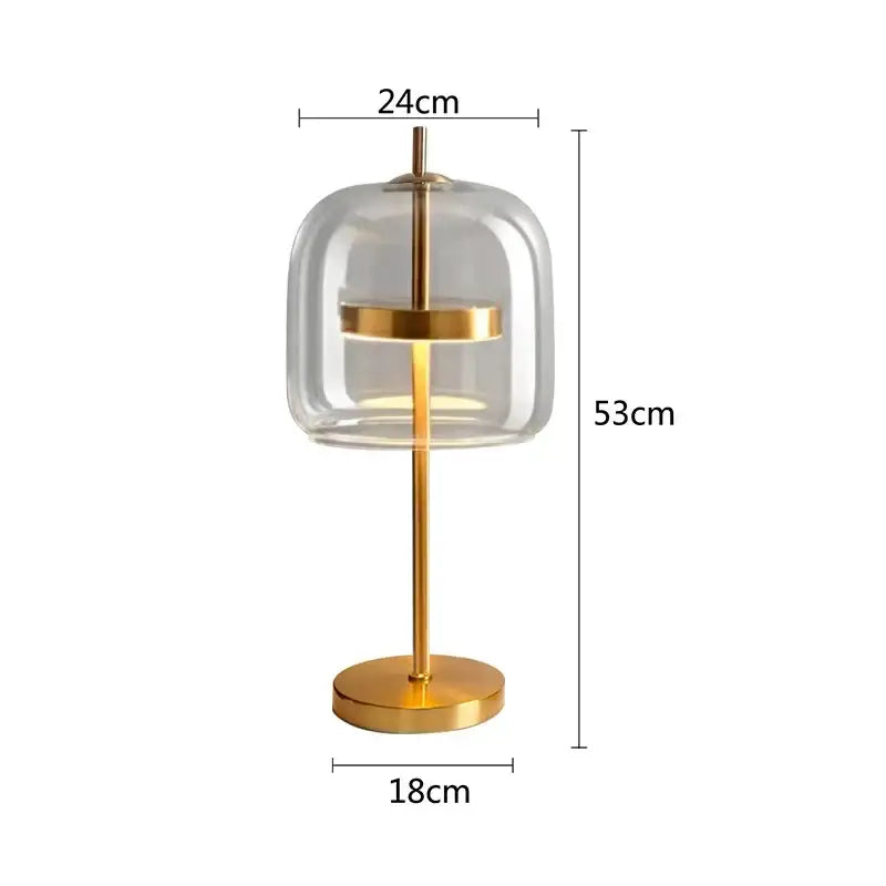 Modern gold and gray glass table lamp with clear glass dome and gold-toned metal frame for bedroom decorbites decor