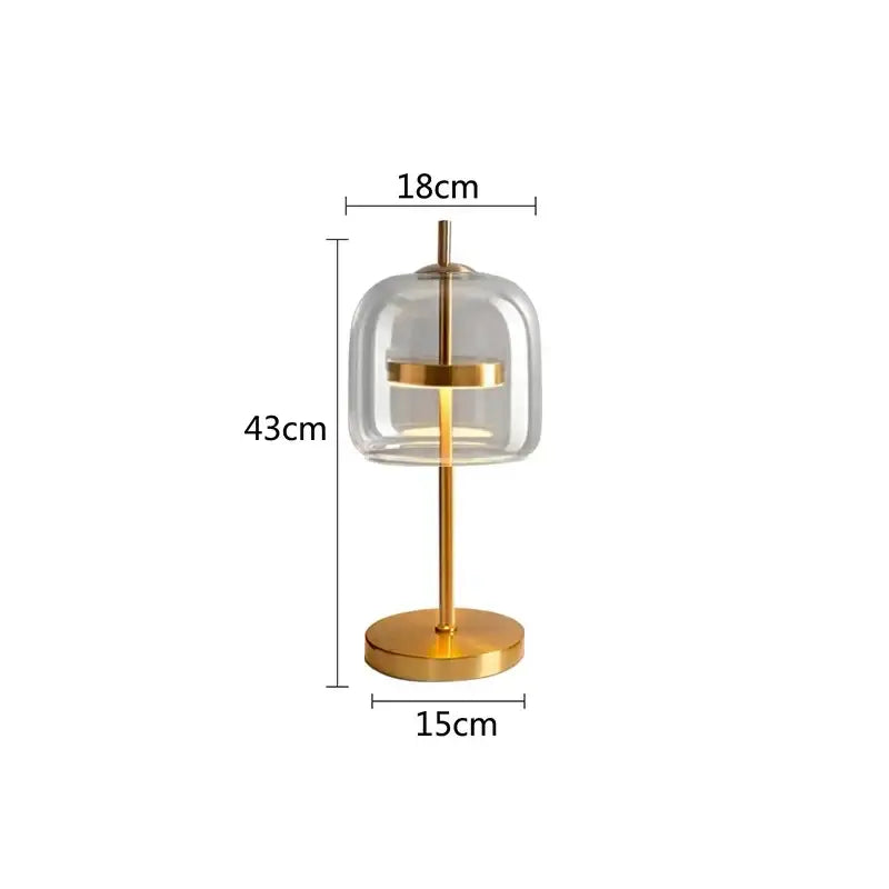 Modern gold and gray glass table lamp with clear glass dome and minimalist design for bedroom decorbites decor