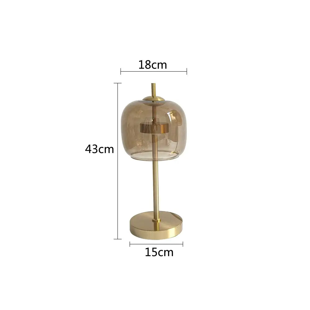 Modern gold and gray glass table lamp with smoked glass globe and brass base for elegant bedroom decorbites glass table decor