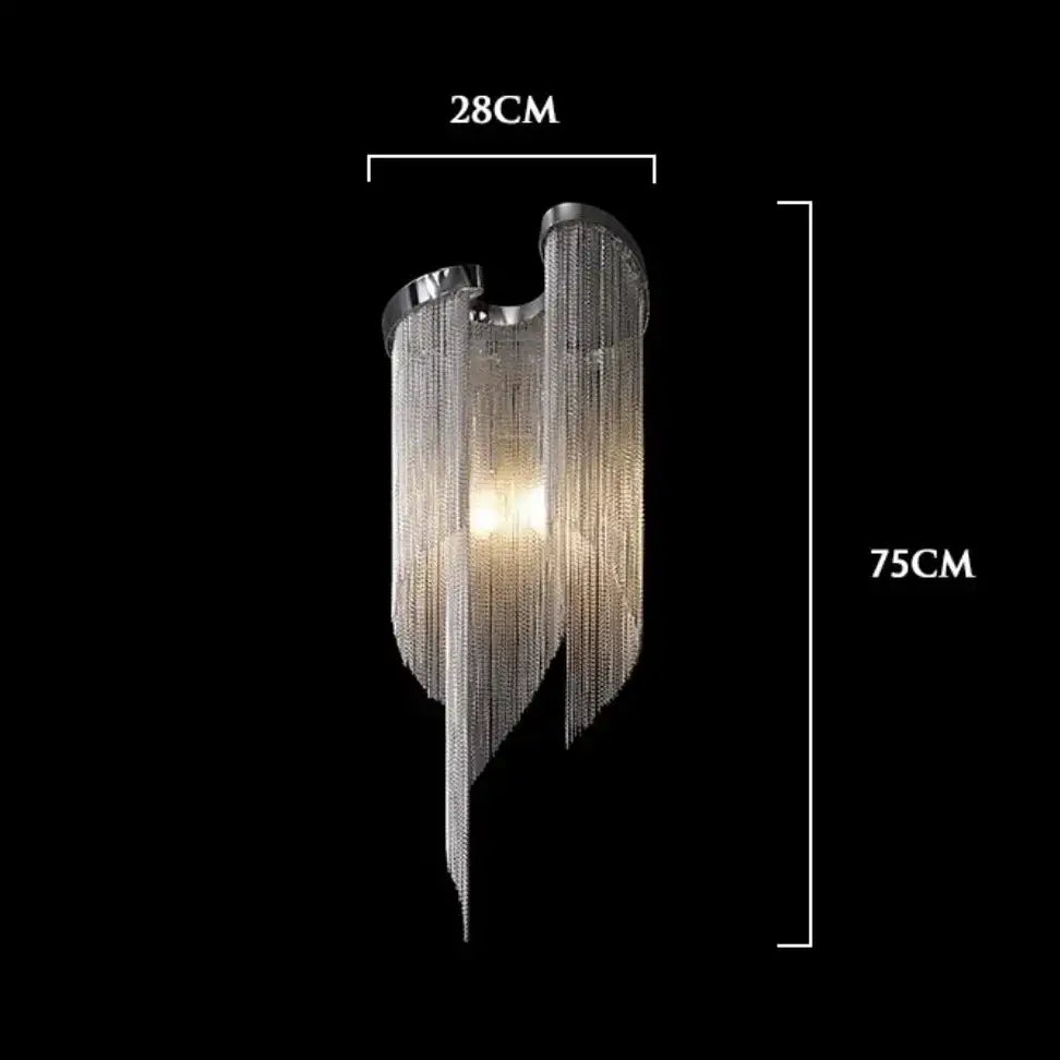 A modern wall lamp with chrome finish gray glass wall lamp featuring cascading silver chains and warm light source