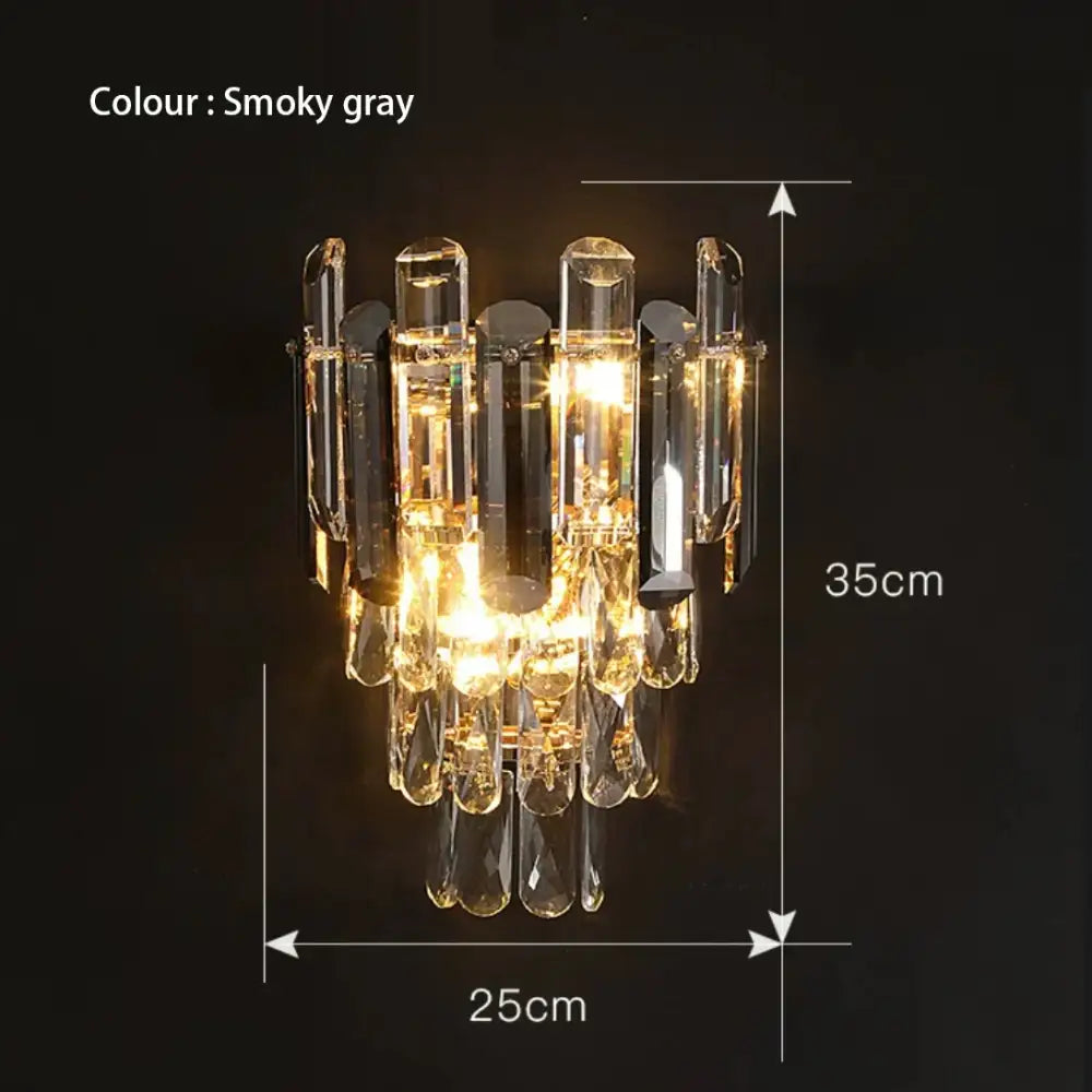 Modern gold and gray glass wall lamp with smoky gray crystal chandelier and vertical dangling glass elements for living room