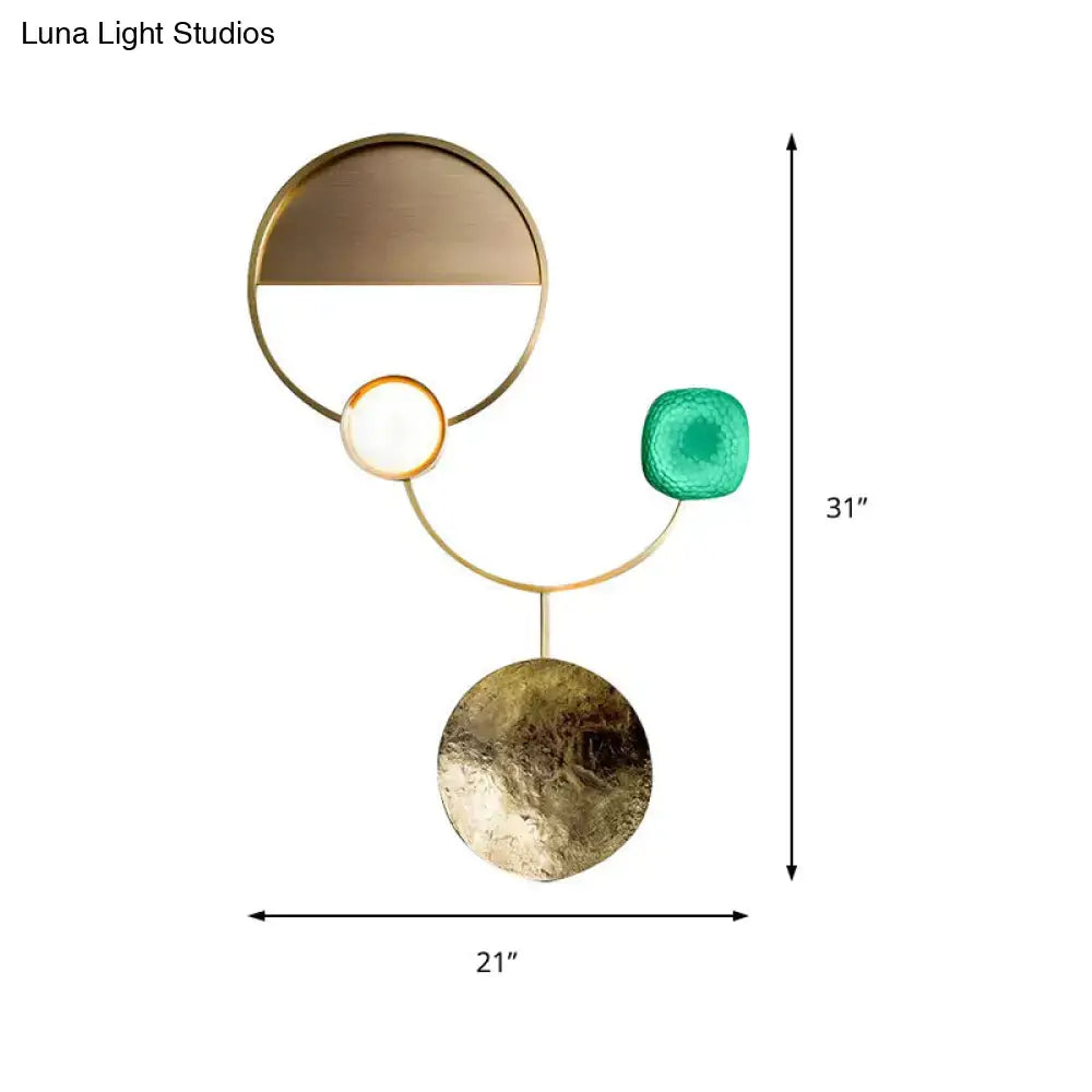 Modern gold and green orbit wall sconce wall lamp with metal frame featuring bronze disc, glowing orb, and teal glass sphere