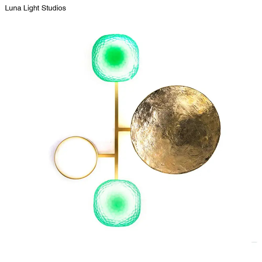 Modern gold and green orbit wall sconce wall lamp with a gold-toned frame and three globe-shaped illuminated shades