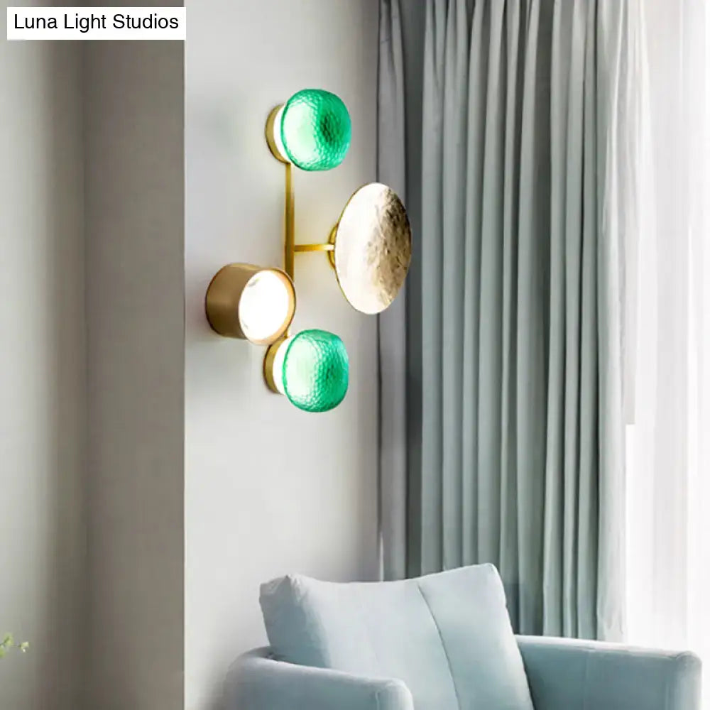 Modern gold and green orbit wall sconce wall lamp with three light fixtures on a slender brass arm for bedroom use