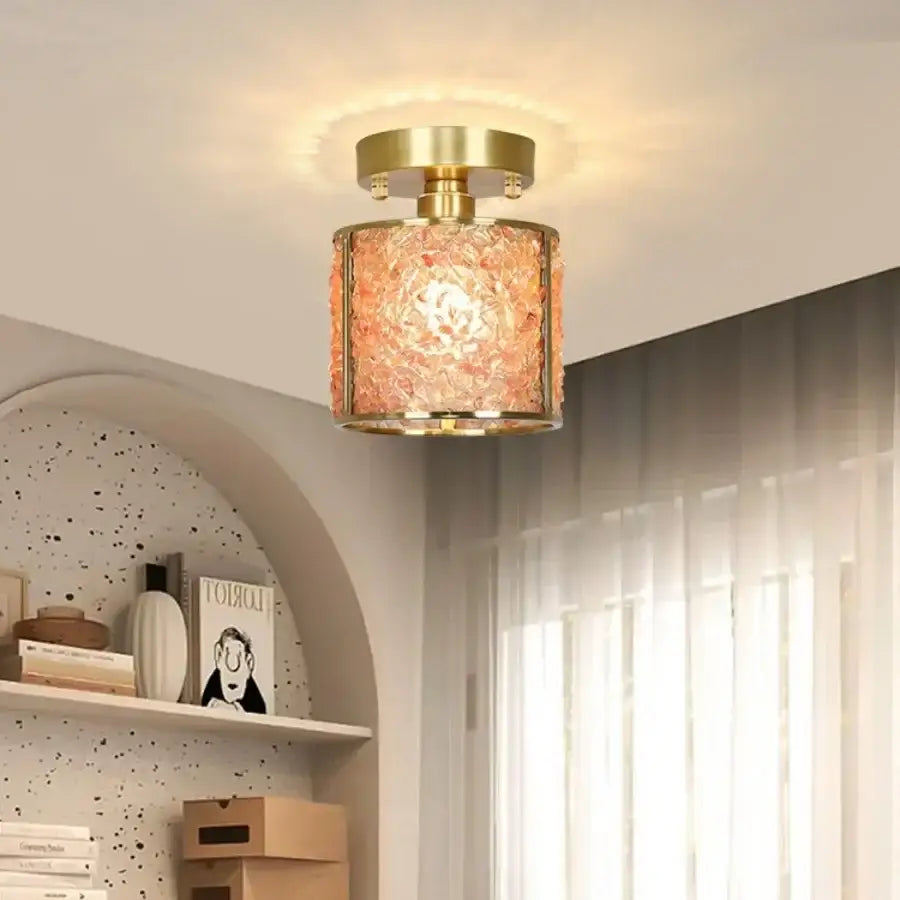 Modern gold and pink column glass crystal ceiling light with textured peach glass shade and gold metal trim by decorbites