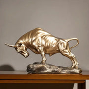 Modern gold and silver bull sculpture featuring a golden metallic decorbites bull on a textured silver rock base office decor