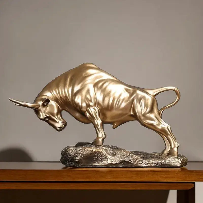 Modern gold and silver bull sculpture featuring a golden metallic decorbites bull on a textured silver rock base office decor