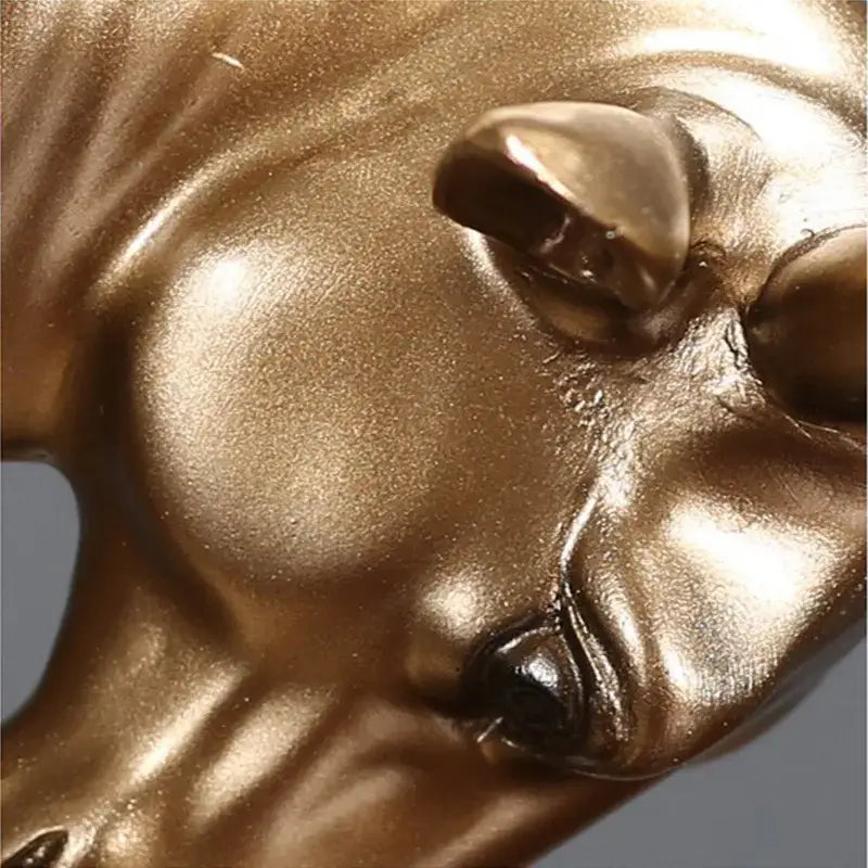 Modern gold and silver bull sculpture office decor figurine featuring a golden metallic horse head with glossy finish decorbites bull sculpture
