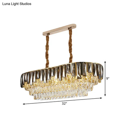 Gold-toned oval chandelier with tiered smoke grey crystal droplets and twisted rope chains for modern ceiling lighting