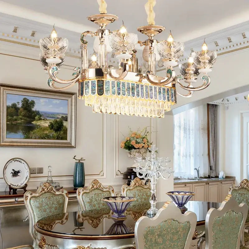 Modern gold and teal crystal candle chandelier with intricate crystal droplets and blue-tinted glass by decorbites crystal