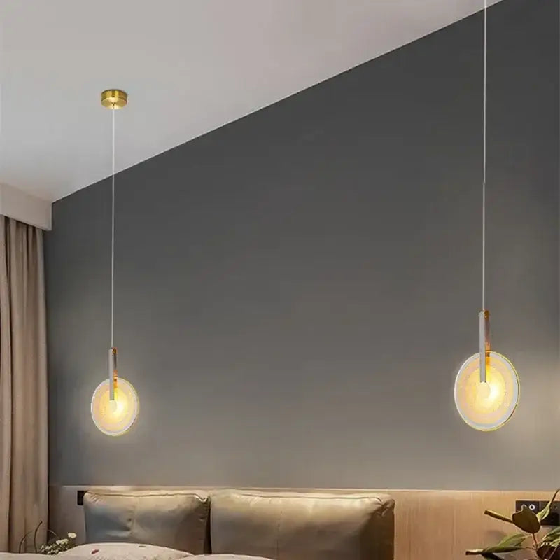 Two minimalist modern gold and white circular glass led chandelier pendant lights with frosted glass shades for dining room decorbites circular glass