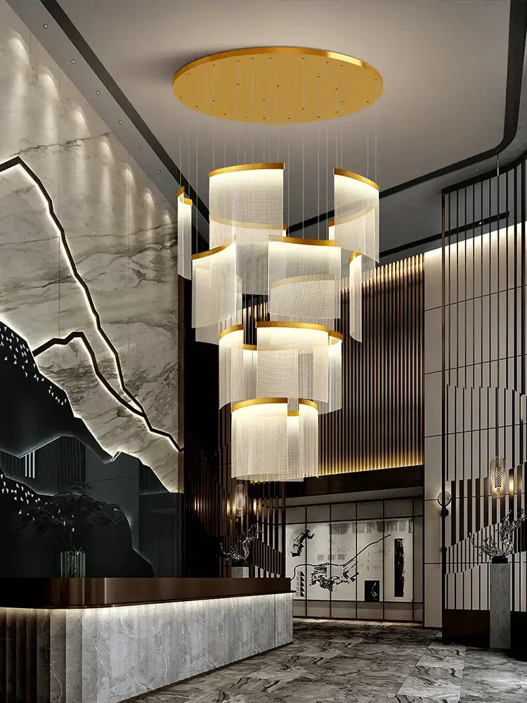 A modern gold and white DecorBites acrylic LED chandelier with translucent cylindrical shades for living room decor
