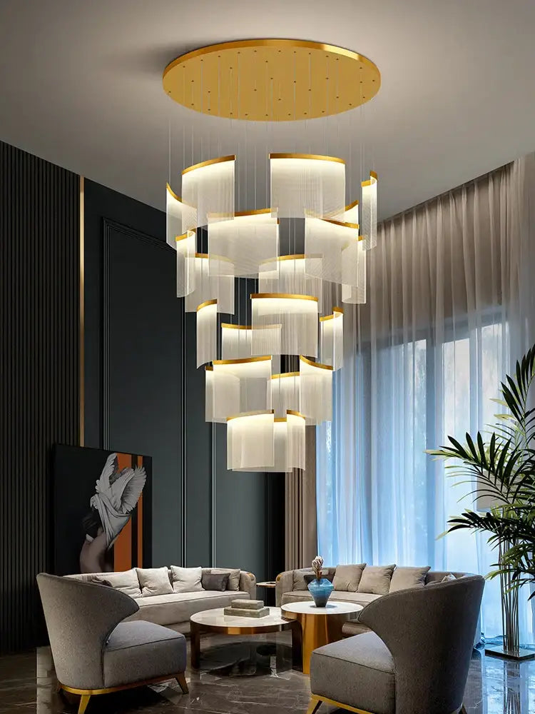 Modern gold and white decorbites acrylic led chandelier with circular fixture and cascading translucent panels for living room