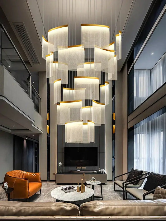 A modern decorbites acrylic led chandelier with layered white panels and gold accents for living room decor