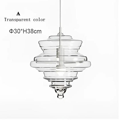 Modern gold and white decorbites glass chandelier featuring a clear glass tiered pendant light for dining rooms