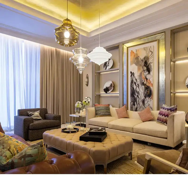 Beige tufted leather ottoman with rectangular black tray complements modern gold and white decorbites glass chandelier dining room light