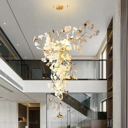 A modern gold and white gingko leaf ceramic chandelier with delicate metallic leaves for living room decorbites lighting