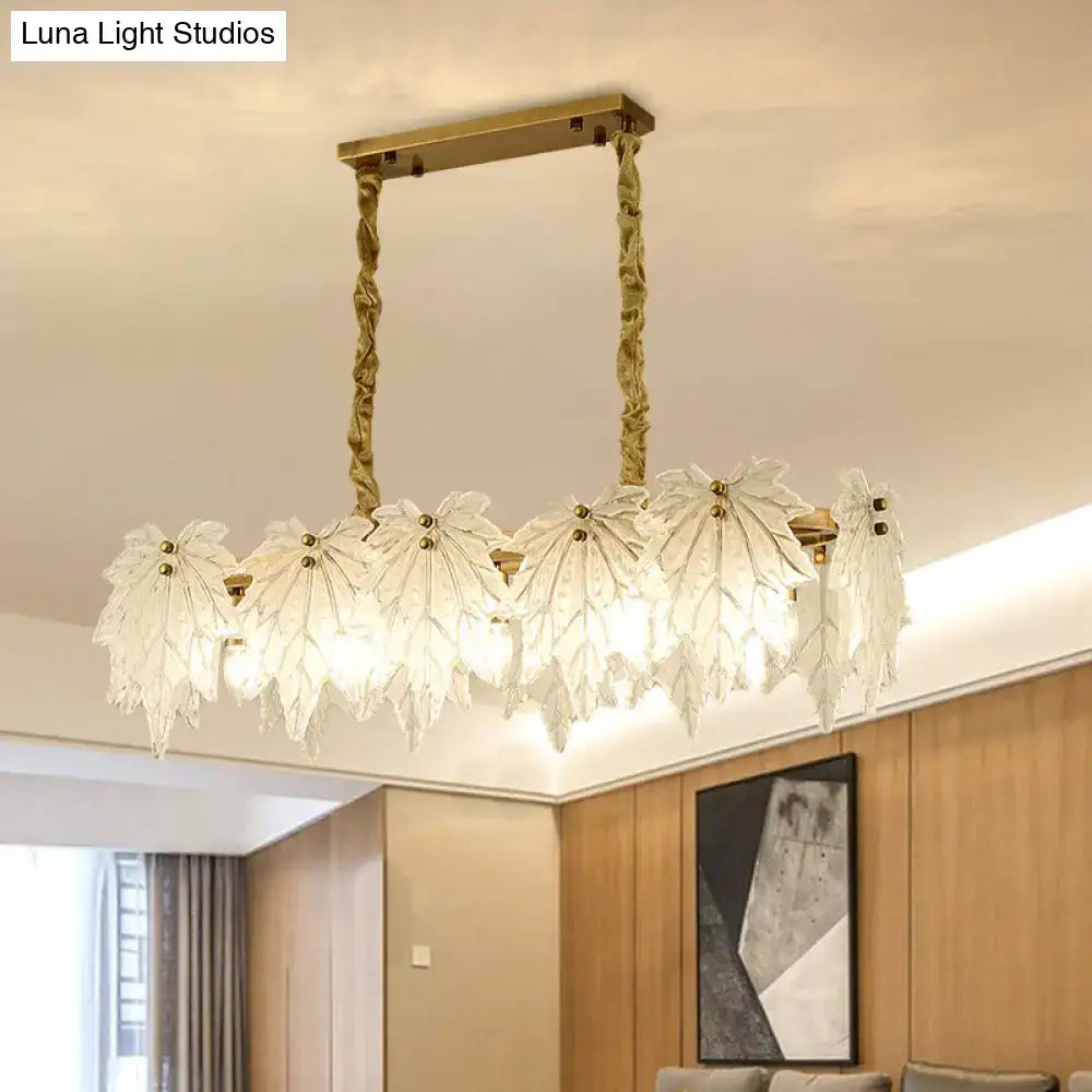 Modern gold and white glass floral pendant light with leaf-shaped white glass shades and twisted metal chains light fixture