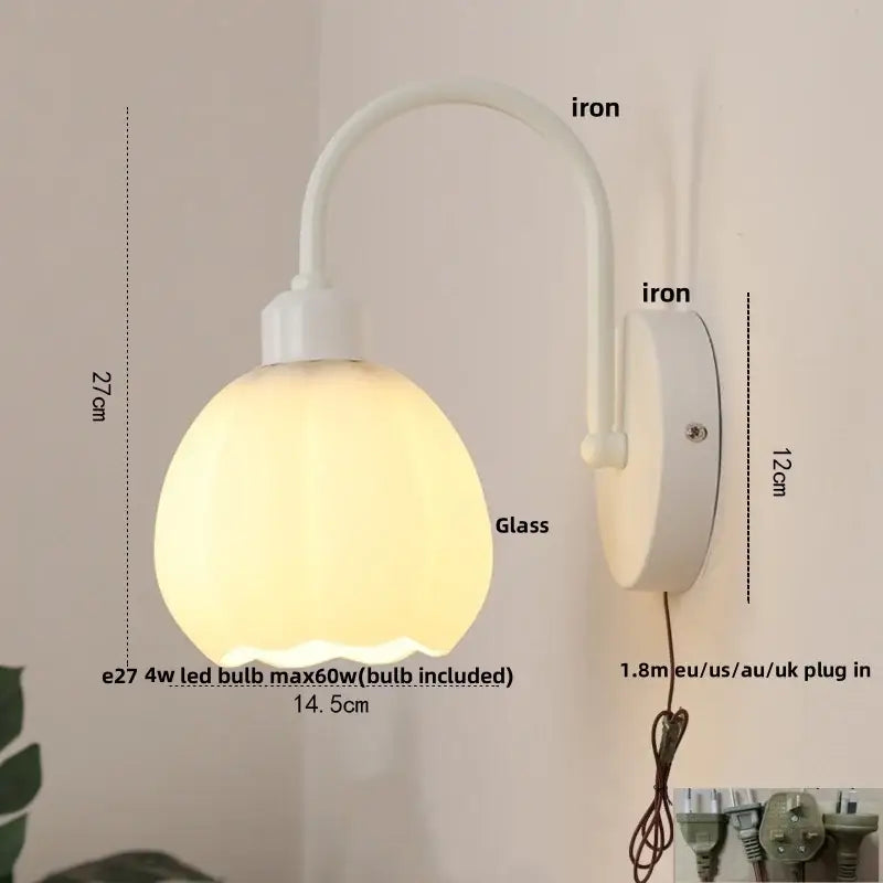 Modern gold and white glass wall lamp with curved decorbites iron white arm and circular mount for stair lighting