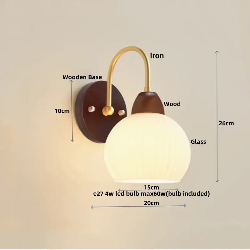 A modern wall lamp with warm white glass, brass iron arm, and dark wood base for stylish decorbites iron white lighting