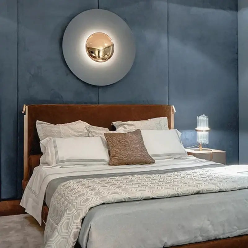 Modern gold and white led ufo wall sconce with polished gold center and matte gray outer ring for bedside decor