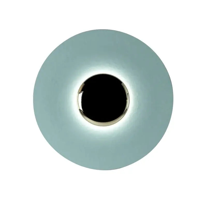 A sleek modern gold and white led ufo wall sconce with a matte finish and circular design for bedside decor