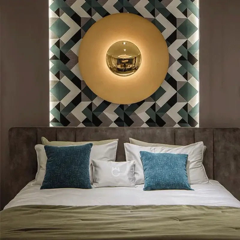 Modern gold and white led ufo wall sconces featuring a golden circular design with a reflective metallic center for ambiance