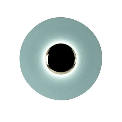 A sleek matte gold and white led ufo wall sconce with a circular design and polished metallic ring for bedroom ambiance