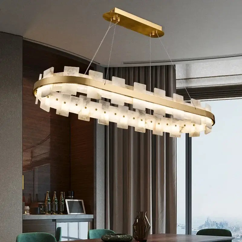 Gold-toned modern bedroom chandelier led with oval design, layered translucent glass panels, and integrated pendant lamp lighting