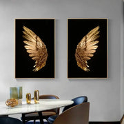Pair of modern gold-leafed angel wing led wall lamps in sleek black frames for bedroom wall art decor