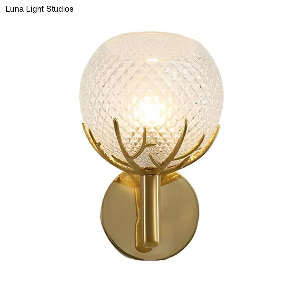 Modern 1-light gold wall sconce with antler design and textured frosted globe featuring clear latticed glass accents