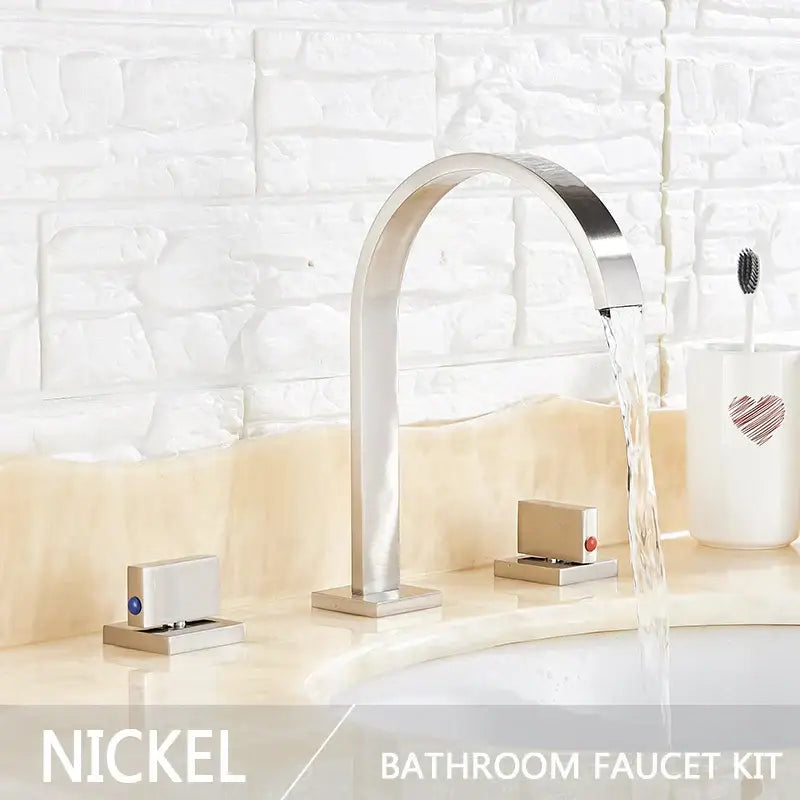 Nickel-finished modern basin faucet set with dual handle design and sleek arched spout for bathroom use