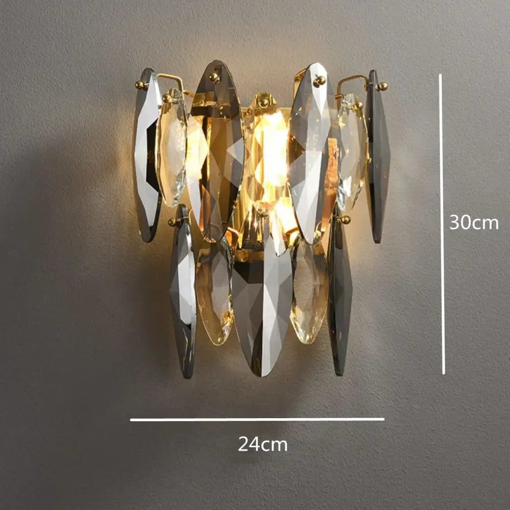 A modern gold ash crystal ceiling chandelier with faceted clear and smoky gray crystal shards and metal fixtures
