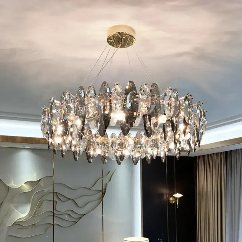 A modern two-tiered decorbites ash crystal ceiling chandelier with faceted glass and gold-toned mount for living room decor