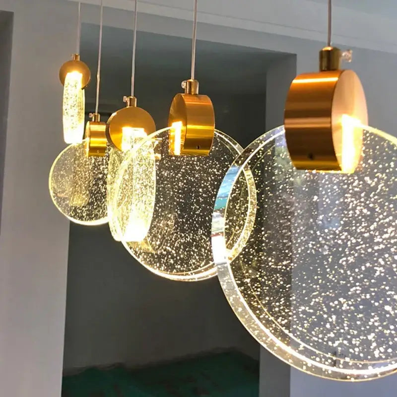 Modern gold attic crystal chandelier with clear bubble-filled glass discs pendant lights for dining room lighting