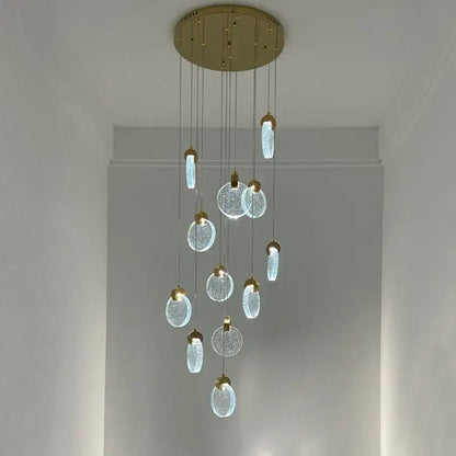 Modern gold attic crystal chandelier with crackled glass discs and soft white light for dining room use