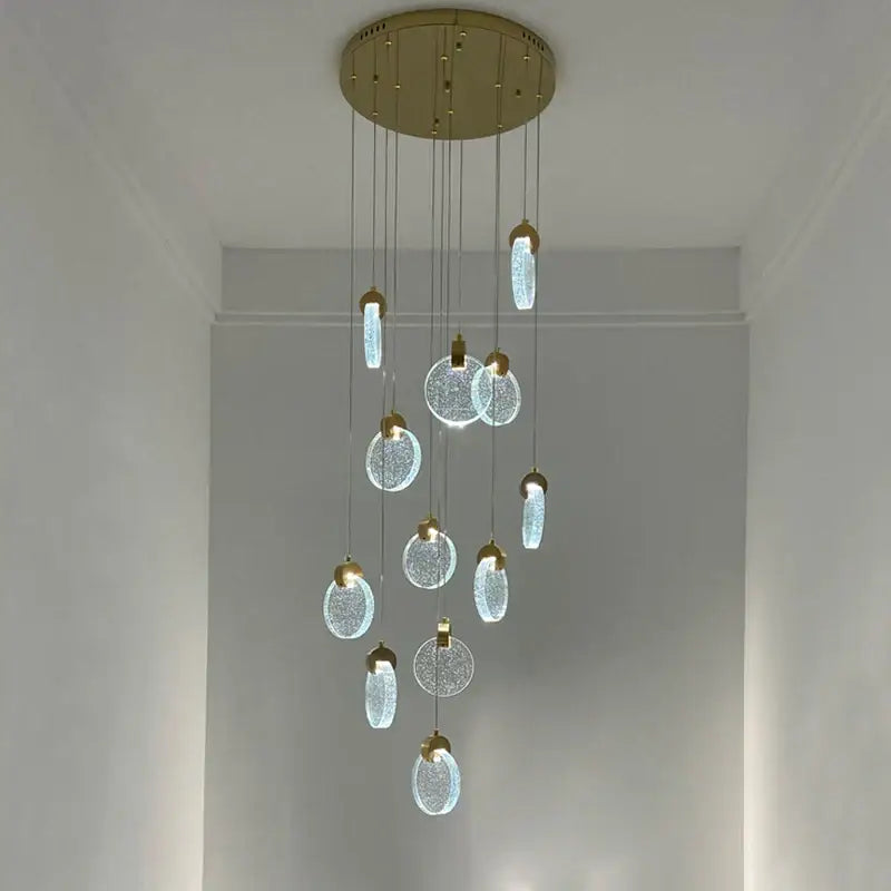 Modern gold attic crystal chandelier with crackled glass discs and soft white light for dining room use