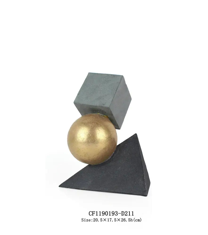 A sleek geometric gold ball sculpture with a matte gray cube on a black triangular base for modern decorbites decor