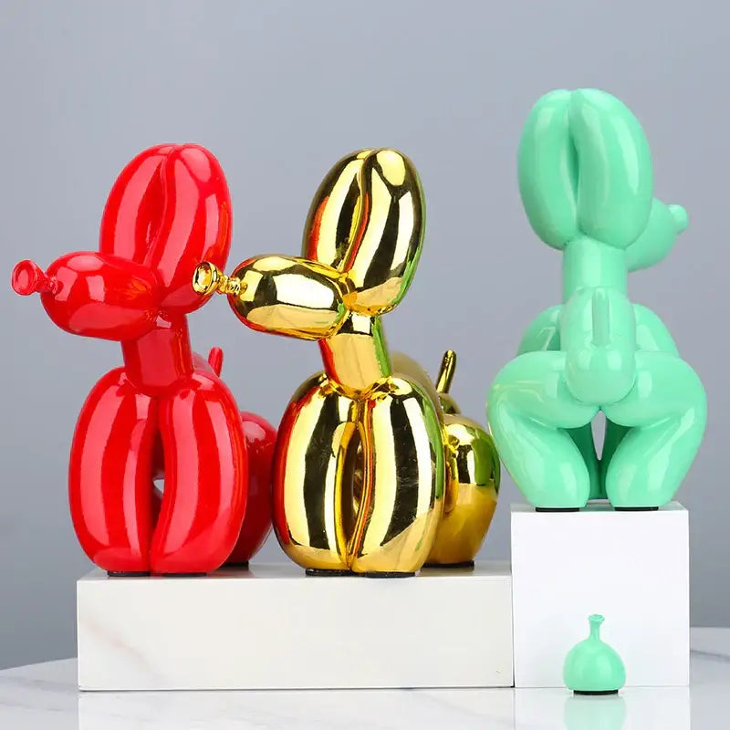 Vibrant glossy red gold and mint green balloon dog statues made of resin for modern living room decor