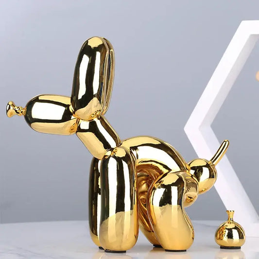 Modern gold balloon dog statue with shiny reflective surface in resin art sculpture for living room decor
