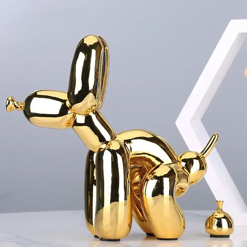 Modern gold balloon dog statue with shiny reflective surface in resin art sculpture for living room decor