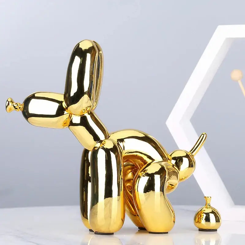 Modern gold balloon dog statue with shiny reflective surface made of resin for living room decor