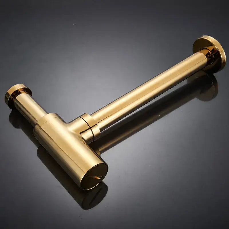Modern gold basin tap siphon kit featuring a gold-colored brass t-shaped pipe fitting with polished cylindrical ends