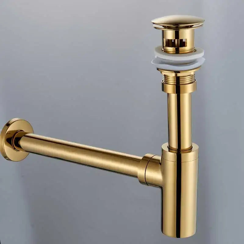 Modern gold brass basin tap siphon kit with white ceramic flange and sleek pop up drain for bathroom use