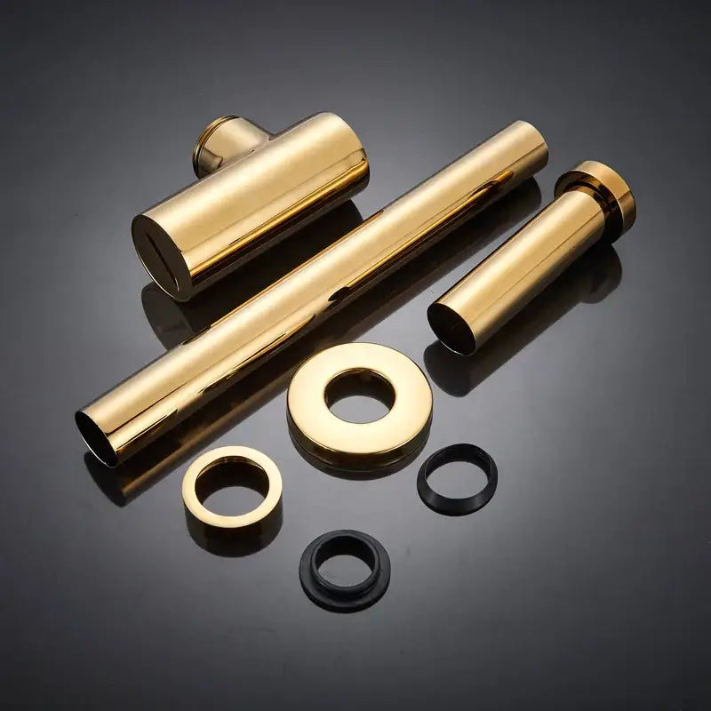 Modern gold basin tap siphon kit with metal cylindrical and circular components for bathroom pop up drain installation