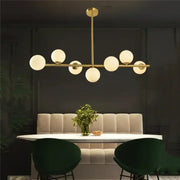 Modern gold bean glass chandelier with seven frosted glass globe bulbs for dining room or living room linear lighting