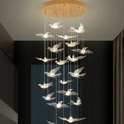 Modern gold bird design led chandelier with translucent crystal birds and warm lighting for living room decorbites bird design