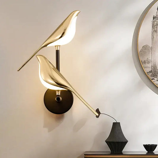 Modern gold bird led wall sconce with sleek reflective surfaces by decorbites for bedroom accent lighting and wall decor